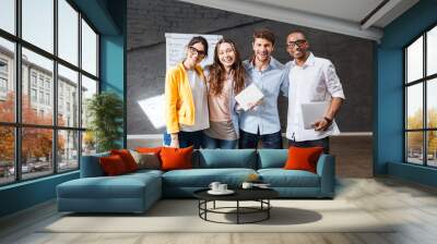 multiethnic group of happy young business people standing in office Wall mural