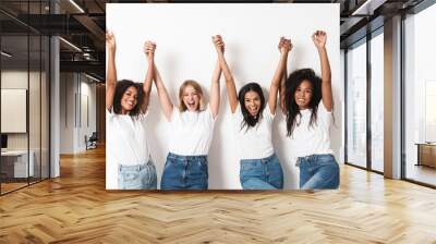 Optimistic cheery young women multiracial friends Wall mural