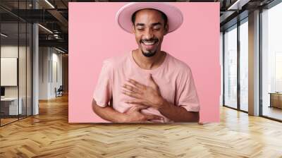 Photo of joyful african american man laughing with eyes closed Wall mural