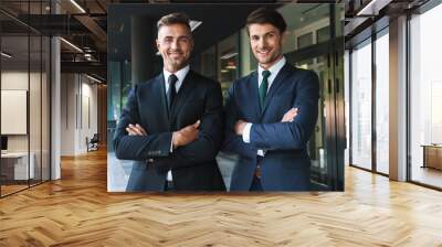 Portrait closeup of two successful businessmen partners smiling while standing outside job center during working meeting Wall mural