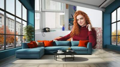 Portrait of a beautiful young redheaded woman Wall mural