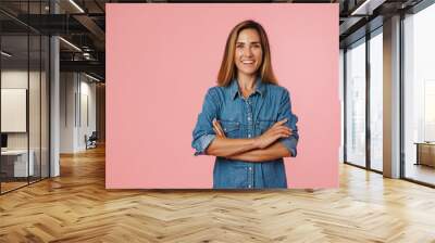 Portrait of a casual happy mid aged woman standing isolated Wall mural