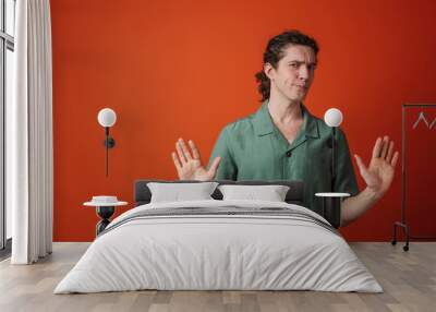 Portrait of a casual man wearing shirt standing Wall mural