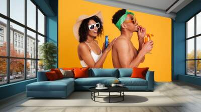 Portrait of a cheerful young african couple in summer clothes Wall mural