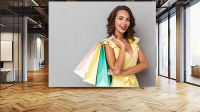 Portrait of a cheerful young girl in dress Wall mural