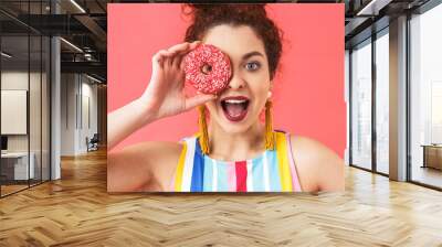 Portrait of a cheerful young woman wearing dress Wall mural