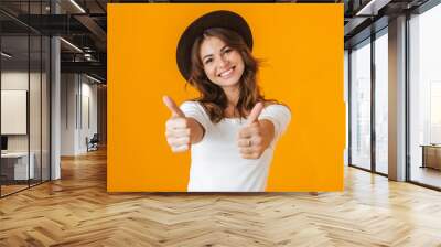 Portrait of a cheerful young woman wearing white shirt Wall mural