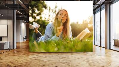 Portrait of a dreamy young girl with backpack Wall mural