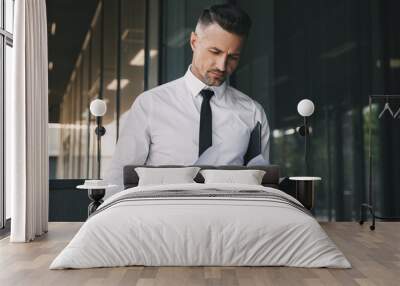 Portrait of a focused young businessman Wall mural