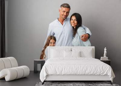 Portrait of a happy family father, mother, little daughter Wall mural