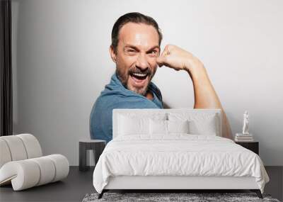 Portrait of a happy mature man dressed in t-shirt Wall mural