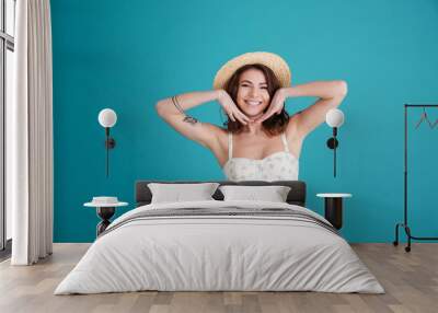 Portrait of a happy smiling girl wearing hat and posing Wall mural