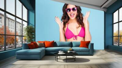 Portrait of a happy smiling woman in sunglasses and bikini Wall mural