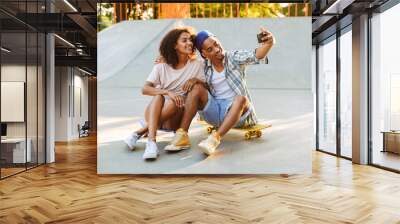 Portrait of a happy young african couple Wall mural