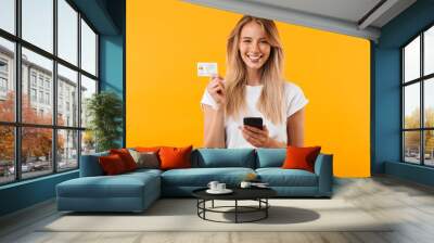 Portrait of a happy young blonde girl Wall mural