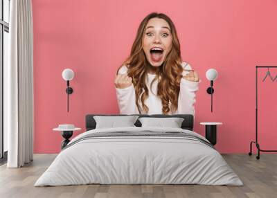 Portrait of a happy young casual girl screaming Wall mural