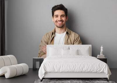 portrait of a happy young casual man standing Wall mural