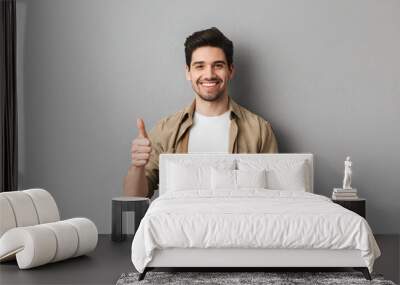 Portrait of a happy young casual man Wall mural