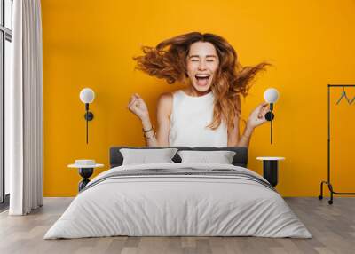 Portrait of a happy young girl screaming Wall mural