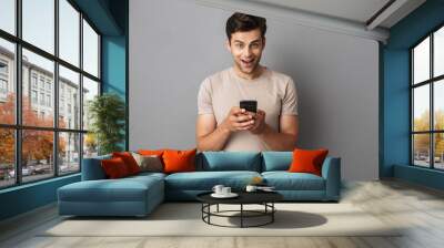 Portrait of a happy young man in t-shirt Wall mural