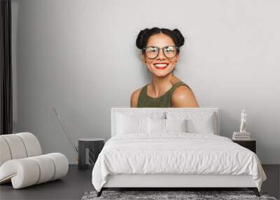 Portrait of a happy young woman isolated Wall mural