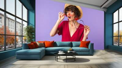 Portrait of a pretty young girl in straw hat Wall mural