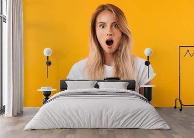 Portrait of a shocked young blonde girl Wall mural