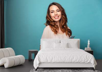 Portrait of a smiling beautiful girl wearing dress Wall mural