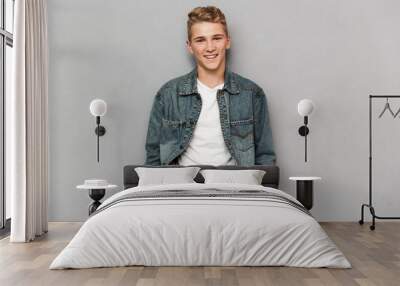 Portrait of a smiling casual teenage boy Wall mural