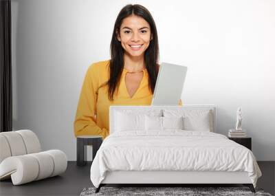 Portrait of a smiling successful woman holding laptop Wall mural