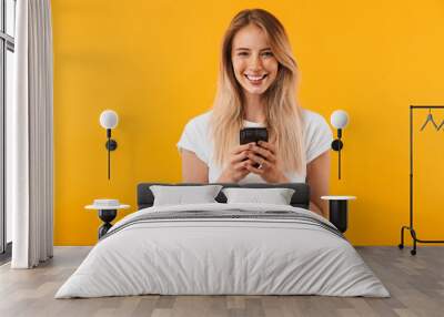 Portrait of a smiling young blonde girl Wall mural