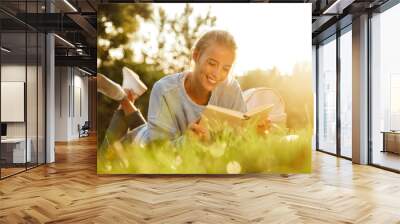 Portrait of a smiling young girl with backpack Wall mural