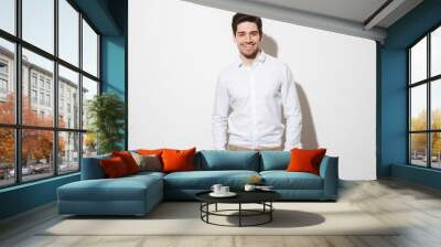 portrait of a smiling young man dressed in shirt Wall mural