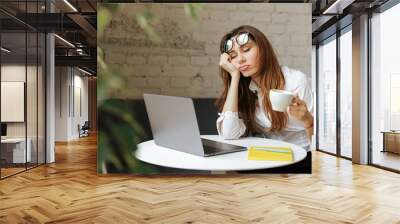 Portrait of a tired young businesswoman Wall mural