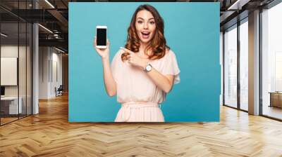 Portrait of an excited beautiful girl wearing dress Wall mural