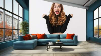 Portrait of an excited pretty young woman Wall mural