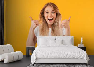 Portrait of an excited young blonde girl Wall mural