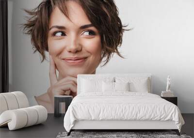 Portrait of beautiful woman with short brown hair in basic t-shirt smiling at camera Wall mural