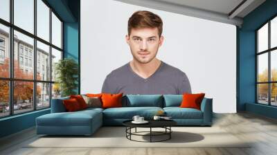 portrait of serious handsome young man in grey pullover Wall mural