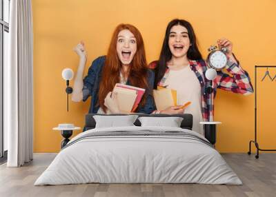 Portrait of two surprised young school teenage girls Wall mural