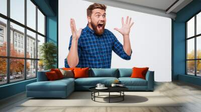 Screaming shocked man looking at copy space Wall mural