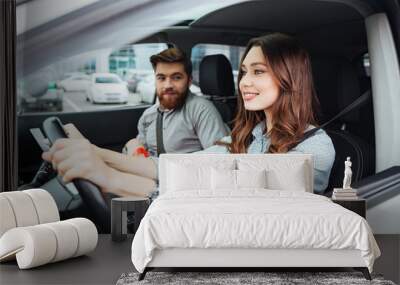 side portrait of fashion couple in car Wall mural