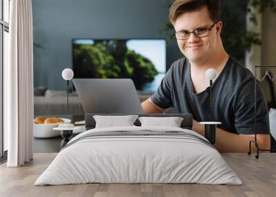 Smiling white young man with down syndrome Wall mural