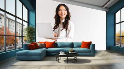 Smiling young asian businesswoman standing Wall mural