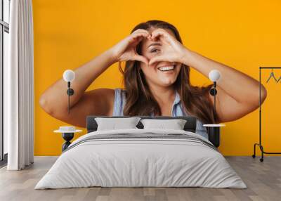 Smiling young overweight woman standing Wall mural