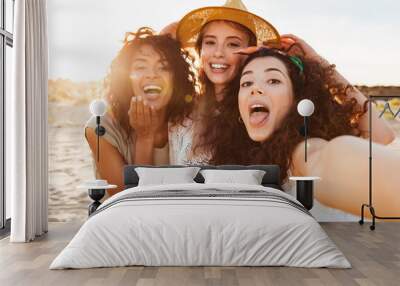 Three funny girls friends in summer clothes Wall mural