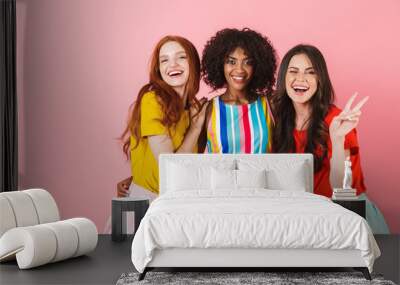 Three lovely young girls wearing summer outfit standing Wall mural