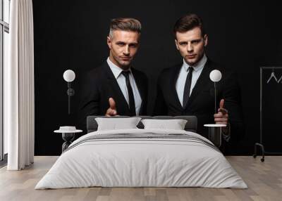 Two confident handsome businessmen wearing suit Wall mural