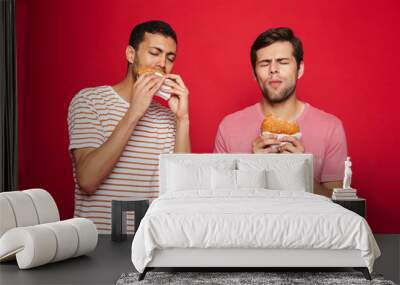 Two delighted men friends standing isolated Wall mural