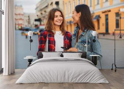 Two smiling young girls friends standing together Wall mural